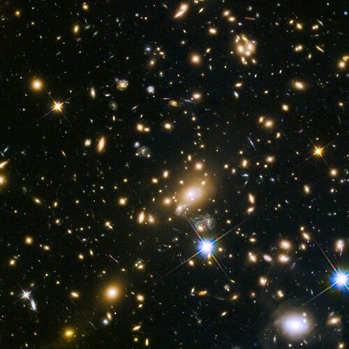 The impressively huge galaxy cluster MACS J1149.5+223, whose light took over 5 billion years to... [+] reach us, was the target of one of the Hubble Frontier Fields programs. This massive object gravitationally lenses the objects behind it, stretching and magnifying them, and enabling us to see more distant recesses of the depths of space than in a relatively empty region. The lensed galaxies are among the most distant of all, and can be used to test the nature of redshift in our Universe.