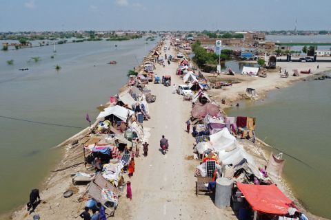 Flood-affected people take refuge in a makeshift camp in Pakistan's Jaffarabad district on Wednesday, August 31.