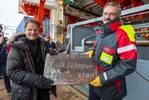 Chief scientist and the captain hold a steel plaque that was especially made for our visit to the North Pole.