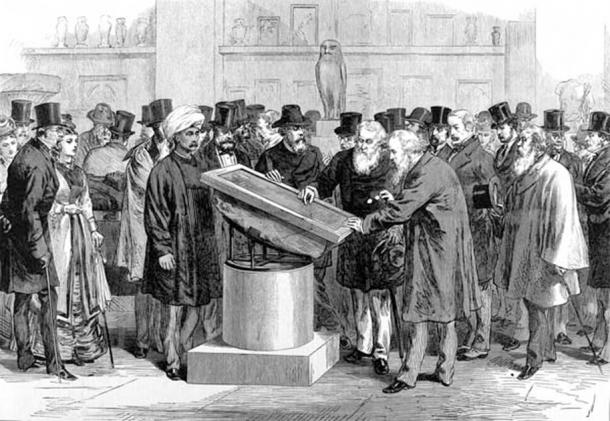 Experts inspecting the Rosetta Stone during the International Congress of Orientalists of 1874. (Public Domain)