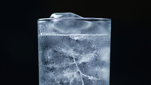 A GIF of ice melting in a glass of water