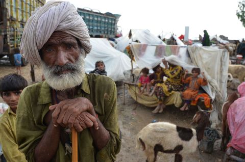Villagers take shelter at a makeshift camp in Pakistan's Jaffarabad district on August 24.